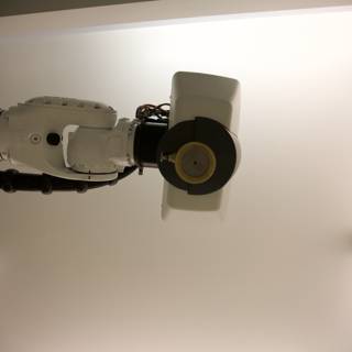 High-Tech Robot on a White Ceiling