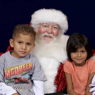 Santa Claus Bringing Joy to Children at APC Xmas Party