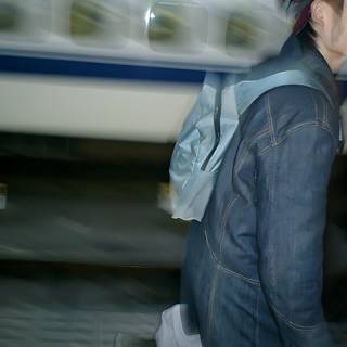 Man Walking in Front of Train at Tokyo Station