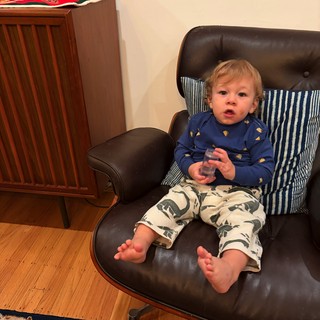 Toddler Relaxing in Mid-Century Modern Lounge Chair