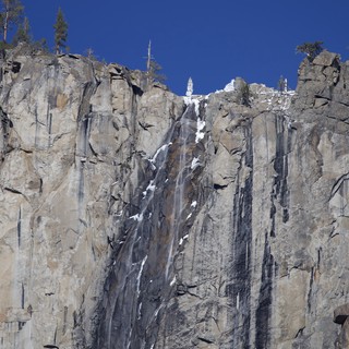 Frozen Waterfall on Columnar Basalt Cliff Face