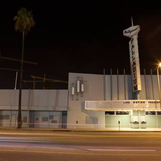 A Night View of the Clock Tower and Palm Trees