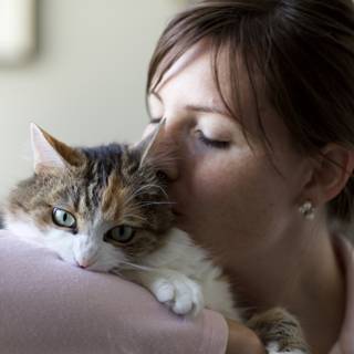 Woman and Kitten Pose for the Camera