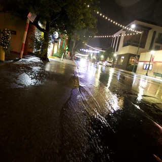 Rainy Night on an Illuminated Downtown Street