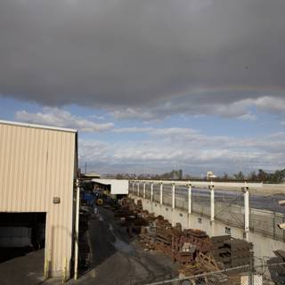 Rainbow over Warehouse Fence