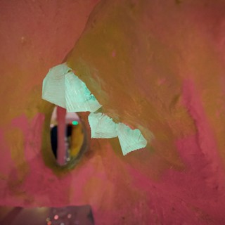 Abstract Pink Interior with Hanging Green Light Installation