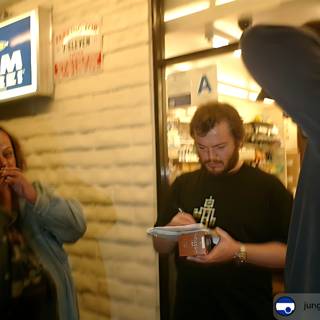 Jack Black on the Phone Outside a Store