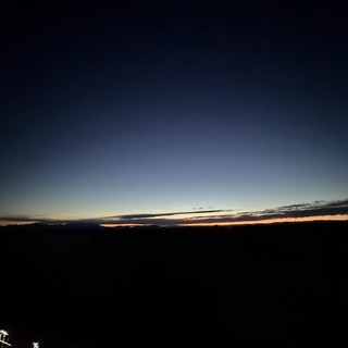 Twilight Glow Over Dark Desert Horizon