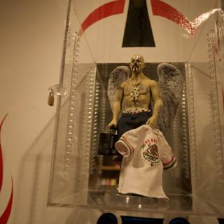 Statue of a Man with a T-Shirt in a Glass Case