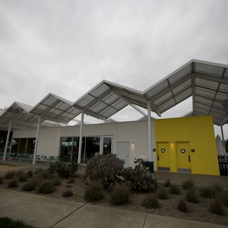 Modern Wave Canopy Architecture at Dusk