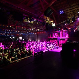 Electric Crowd Pulses Under Magenta Lights at Wobbleland
