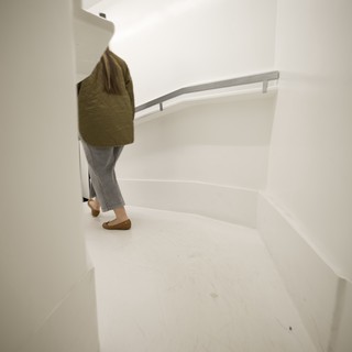 Ascending the Minimalist White Spiral Staircase