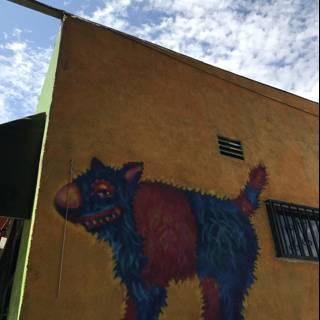 Colorful Mural of a Dog on a Yellow Building