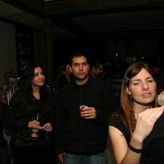 Friends Socializing at a Dimly Lit Bar Night