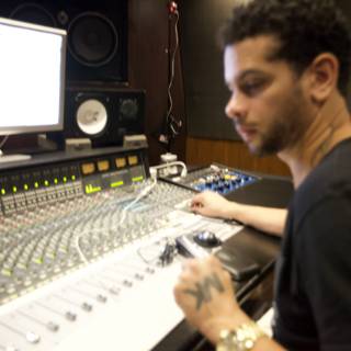 Marc Kinchen mixing tracks in recording studio