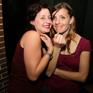 Two Friends Sharing a Joyful Moment at Night