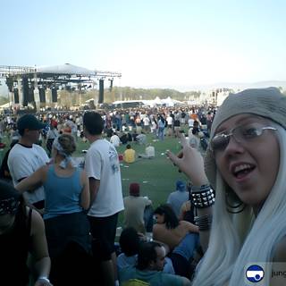 Woman with White Hair and Glasses in Front of a Crowd at Coachella