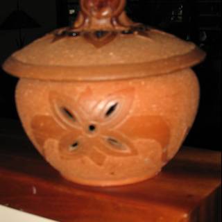 Brown Ceramic Jar on Wooden Table
