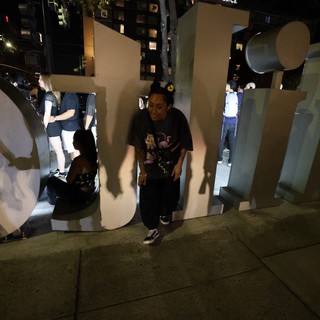 Night Revelers Pose Among Giant Festival Letters