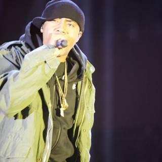 Nas Takes Center Stage in Green Jacket and Black Hat