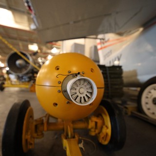 Vintage Aircraft Engine Close-up in Museum Hangar
