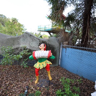 Vintage Strongman Figure at Abandoned Amusement Area