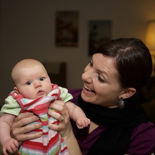 Mother's Joy: Tender Moment with Newborn Baby