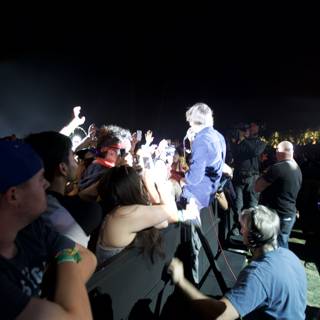 Man in Suit Addresses Coachella Crowd