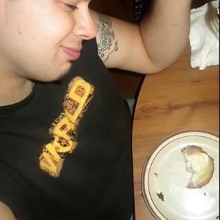 Tattooed Man Enjoying a Meal