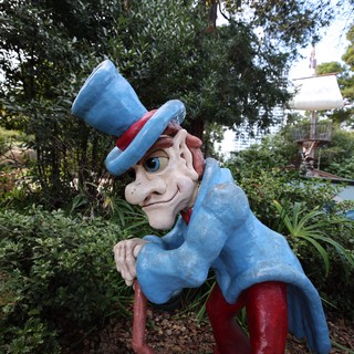Weathered Uncle Sam Statue in Garden Setting