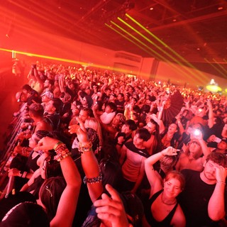 Massive Crowd Erupts Under Red Laser Light Show