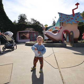 Toddler Explores Whimsical Fairytale Theme Park Area