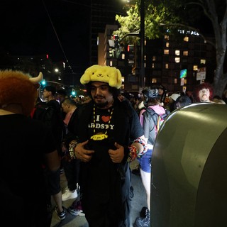 Festival Goer in Pompompurin Hat at Night Event