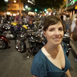 Smiling Woman at Night Motorcycle Rally Austin