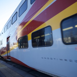 Double-Decker Rail Runner Train at Sunset Station