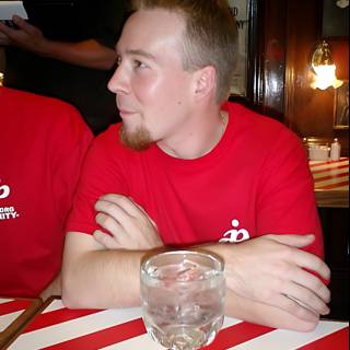 Red Shirted Man at Restaurant