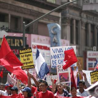 Parade of People Holding Signs and Flags in Support of Hugo Chávez