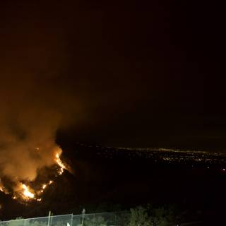 Inferno Engulfs Hills at Night
