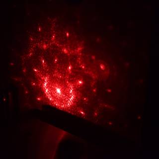Red Laser Light Illuminates Wall