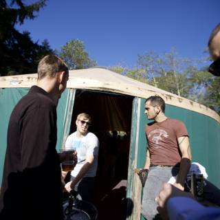 Three Men Enjoying the Great Outdoors in a Yurt
