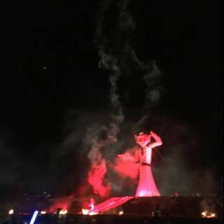 Fiery Statue at Night