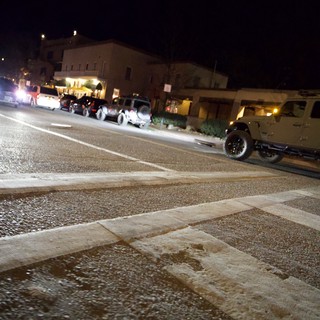Nighttime Jeep Gathering on Wet Street