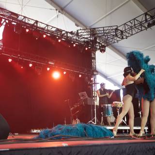 Blue Feathered Performers on Stage