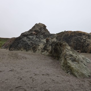 Ancient Coastal Rocks on a Misty California Beach