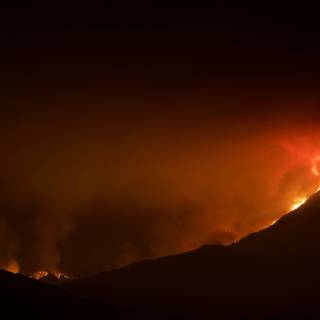 Nighttime Blaze in the Mountains
