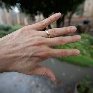 Hand with Wedding Ring in Garden Setting