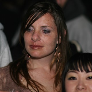 Two Women at Nightclub Event, Emotional Moment