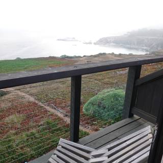 Overlooking the Ocean from a Serene Deck Bench