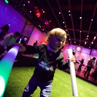 Toddler Dancing with Light Stick at Baby Rave