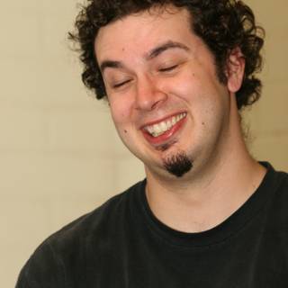 Curly-haired Dave B's Infectious Smile